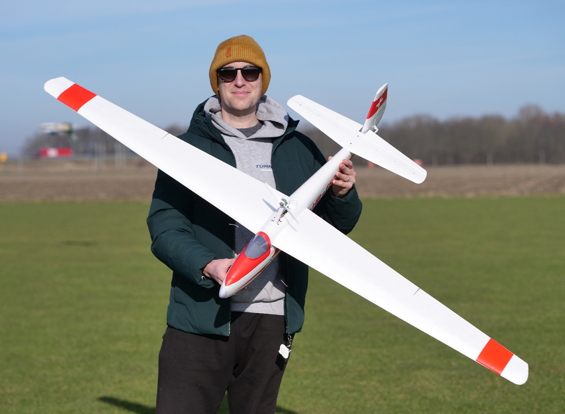 Pilot preparing to hand launch the HobbyKing Hall Cherokee V2 1700mm glider